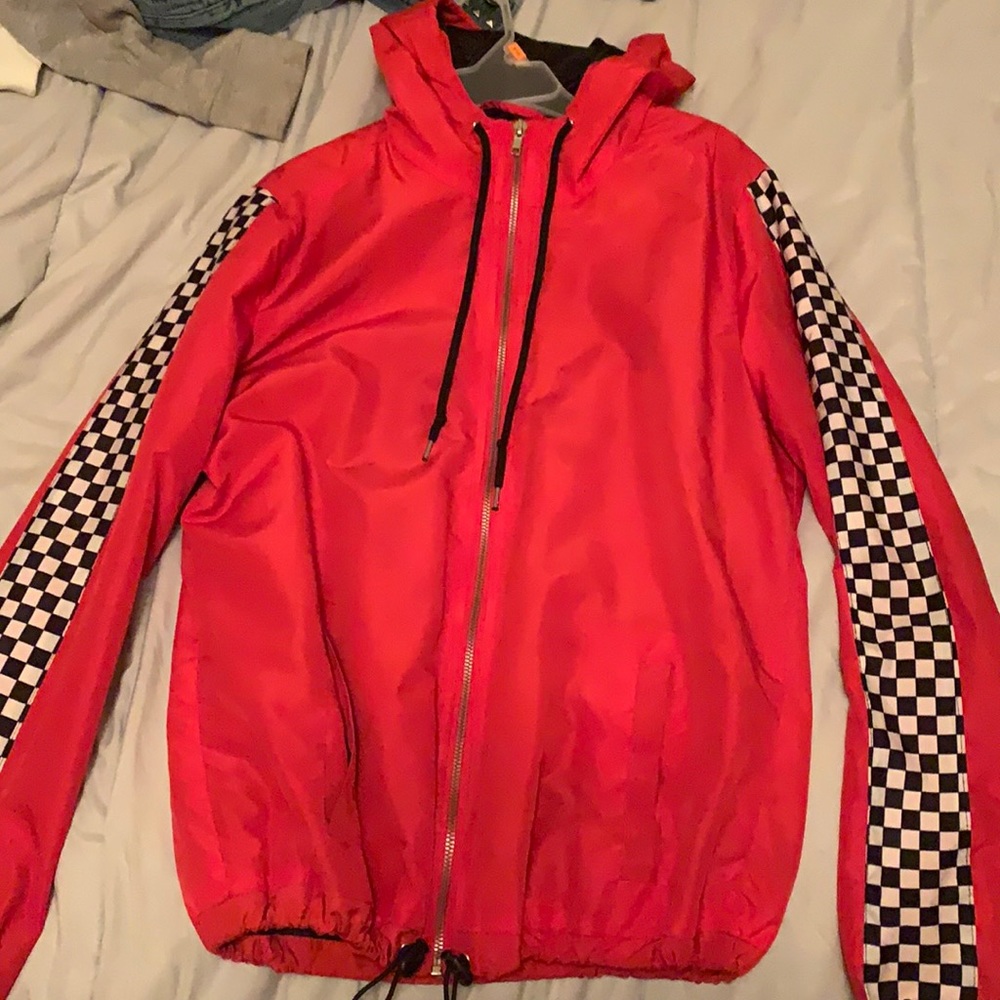 Wind Blazer , red with black and white on the sleeves .